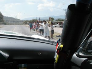 Local people cheering the Carrera Panamericana racers